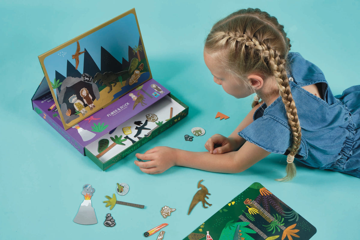 A kid independently playing with a magnetic book